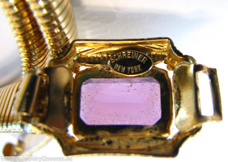 Schreiner one large rectangle faceted open back emerald cut purple goldtone jewelry