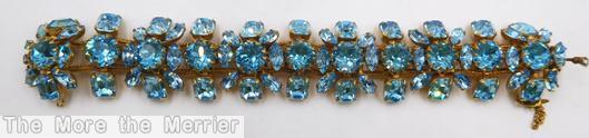 Schreiner 2 strand 11 round cab 12 small navette center row blue goldtone jewelry