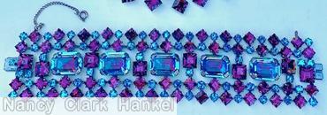 Schreiner 5 row wide bracelet 5 large emerald cut in center 12 square stone 13 small chaton border row 13 square stone 12 small chaton inner row bicolor ruby clear aqua large emerald cut purple square stone clear aqua stone jewelry