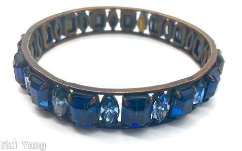 Schreiner single row of 15 large emerald cut bangle 15 navette copper back copper marina blue faceted emerald cut ice blue faceted navette jewelry