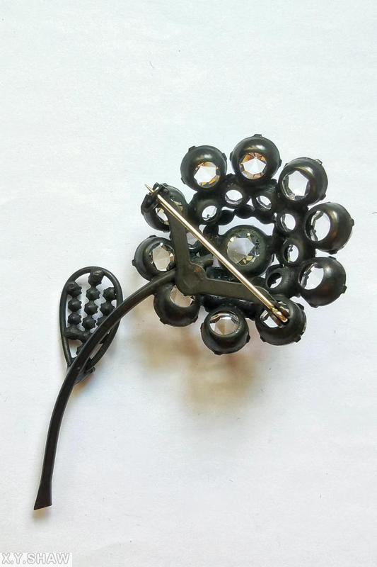 Schreiner long stem inverted stone 1 flower 1 leaf pin flower 1 large round stone center 10 surrounding stone wire border leaf 14 small inverted chaton inverted crystal gunmetal jewelry