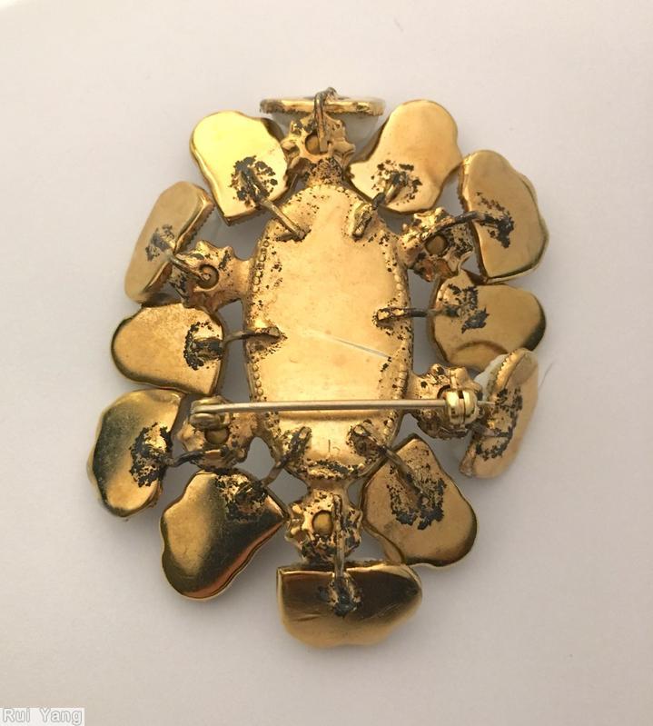 Schreiner 12 lava stone random arranged pin large oval center 6 surrounding chaton moonglow white centerl large oval cab white lava stone brown goldtone jewelry