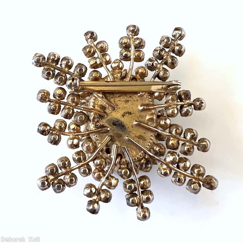 Schreiner 12 varied length branch snowflake pin large oval center 12 surrounding stone 12 surrounding metalic colored faux pearl large faceted oval topaz center clear champagne chaton goldtone jewelry