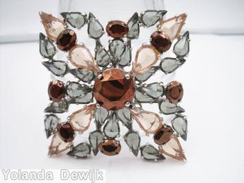 Schreiner 2 level radial cross pin large round stone center bottom level 8 surrounding small teardrop top level 8 surrounding small teardrop smoke peach metalic brown jewelry