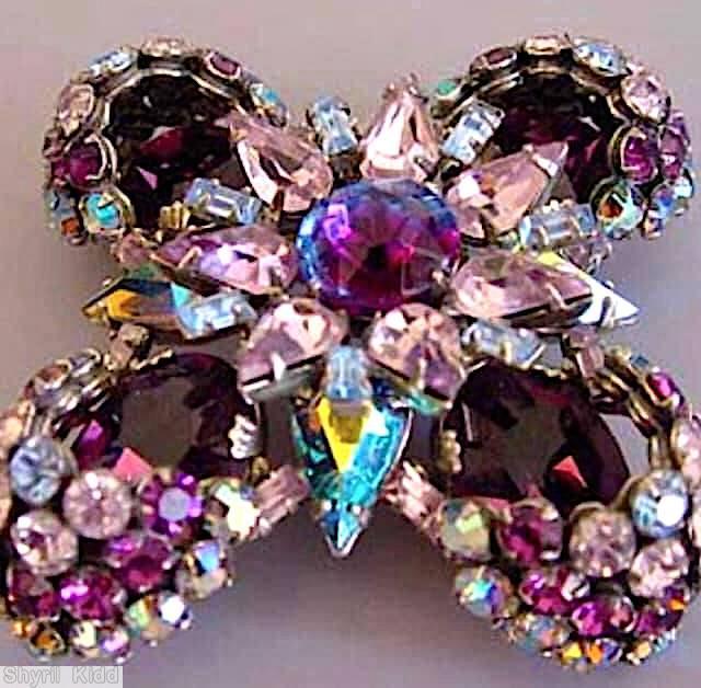 Schreiner 2 level radial maltese pin bottom 4 large oval 4 half acorn cluster 4 teardrop top round center 7 teardrop surrounding ruby navy bicolor faceted round center stone pale pink teardrop large ab teardrop purple large oval faceted oval stone ab chaton fuschia chaton crystal chaton jewelry