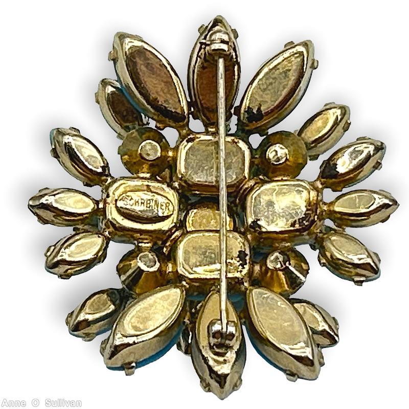 Schreiner 2 level redical pin top chaton center 8 surrounding branch of 2 navette bottom 4 large rectangle stone 2 group of 3 large navette 2 group of 3 small navette aqua chaton center opaque babyblue navette ice blue faceted navette goldtone jewelry