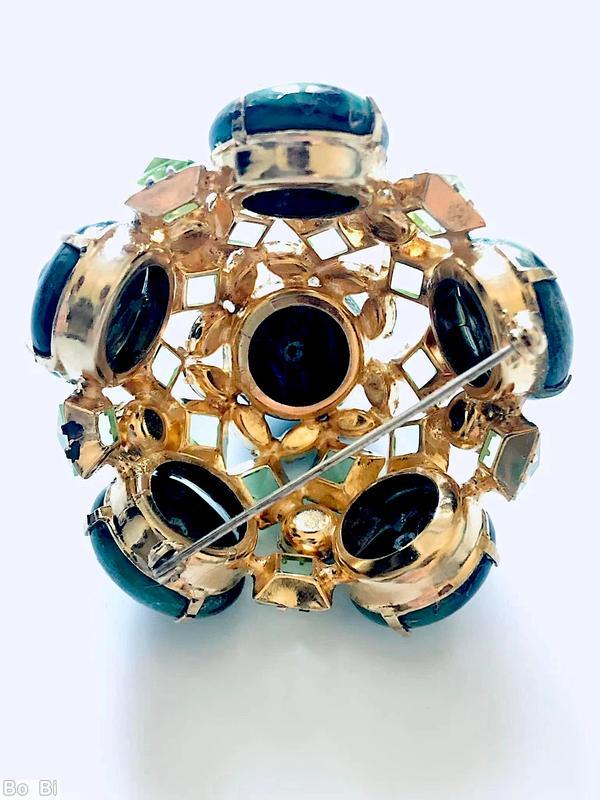 Schreiner 3 rounds domed radial pin 6 large round art glass stone 8 surrounding tilted navette 2nd round 10 faceted square stone side wall 5 large round stone marbled green large round cab celery faceted square stone blue small faceted navette goldtone jewelry