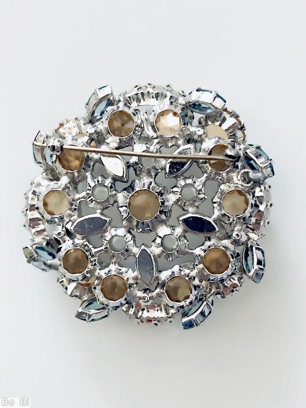 Schreiner 4 large oval stone 4 large round stone wall concave round stone center 5 small chaton surrounding 5 navette large crystal round cab topaz large inverted pointy stone smoky blue faceted small navette silvertone jewelry