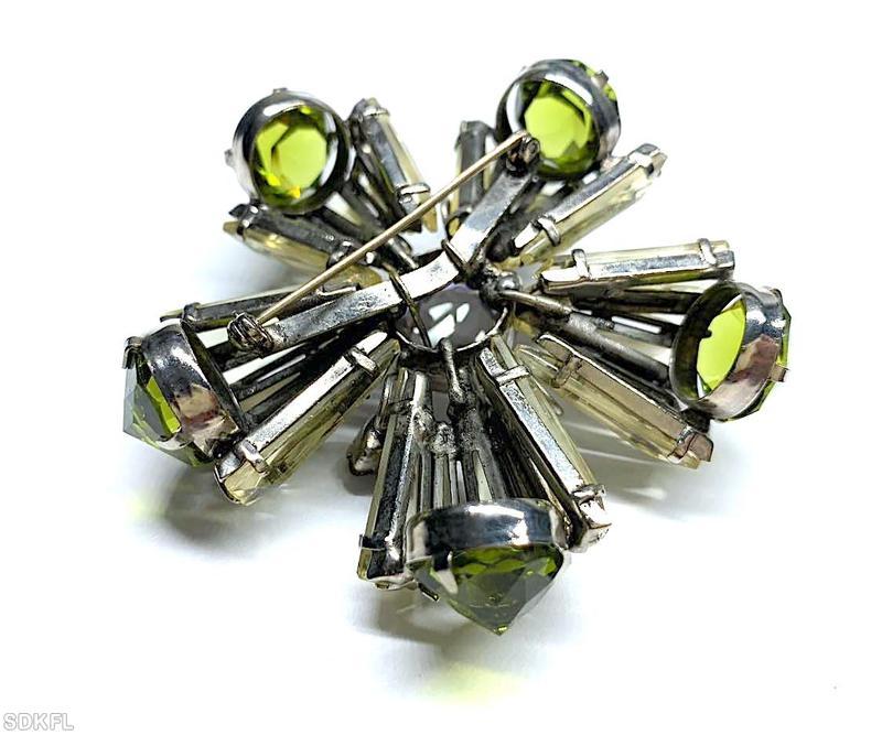 Schreiner 5 petal keystone radial 2 level pin pointy stone end faceted chaton center 5 navette top level champagne glass keystone peridot large faceted inverted bi color ruby green navette large faceted round center stone jewelry