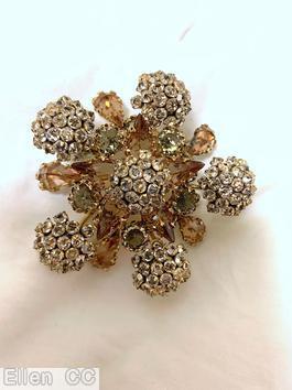 Schreiner 5 pointy star shaped domed radial 2 level pin 6 clustered ball clustered ball center 10 teardrop smoky gray large faceted round stone crystal small inverted stone peach large faceted teardrop goldtone jewelry