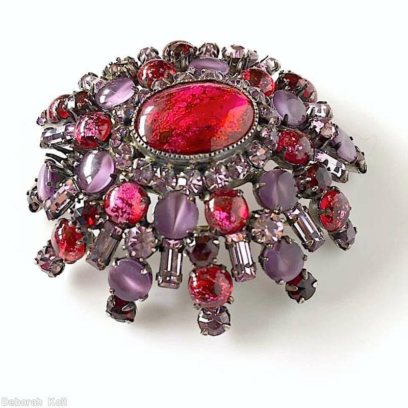 Schreiner 5 rounds varied length domed radial oval pin large oval center 16 small surrounding chaton small baguette dragonbreath pink on red large oval cab center tiger eye purple small oval cab ice pink small inverted stone dragonbreath pink on red small round cab ice pink small baguette silvertone jewelry