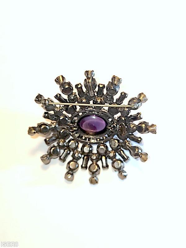 Schreiner 5 rounds varied length domed radial oval pin large oval center 16 small surrounding chaton small baguette large oval purple cab center smoky small baguette bicolor ruby crystal chaton purple small chaton small surrounding crystal chaton silvertone jewelry