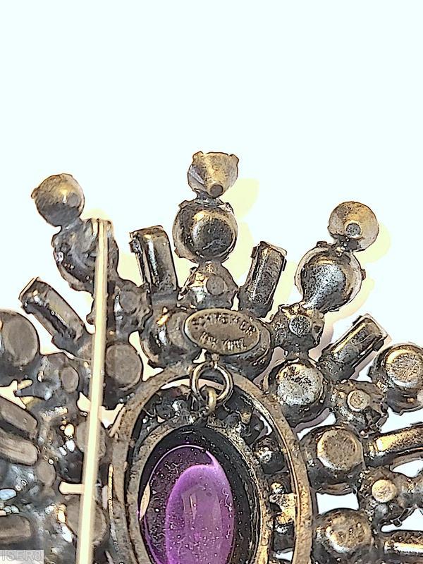 Schreiner 5 rounds varied length domed radial oval pin large oval center 16 small surrounding chaton small baguette large oval purple cab center smoky small baguette bicolor ruby crystal chaton purple small chaton small surrounding crystal chaton silvertone jewelry