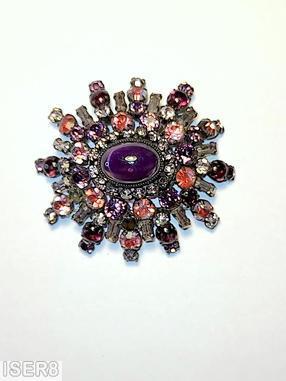 Schreiner 5 rounds varied length domed radial oval pin large oval center 16 small surrounding chaton small baguette large oval purple cab center smoky small baguette bicolor ruby crystal chaton purple small chaton small surrounding crystal chaton silvertone jewelry
