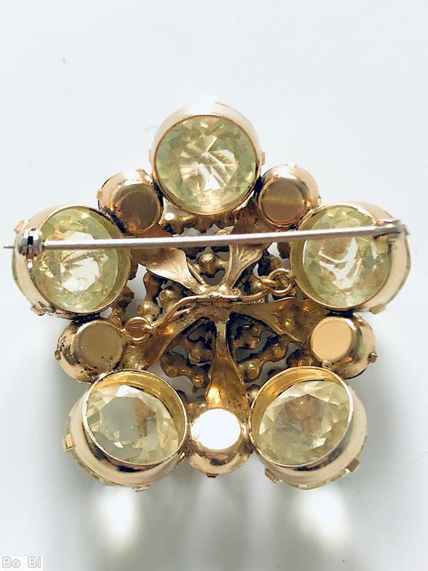 Schreiner 5 wired seeds petal radial pin 5 metal leaf red small chaton center metalic jet small chaton large champagne faceted oval stone peridot inverted stone goldtone jewelry