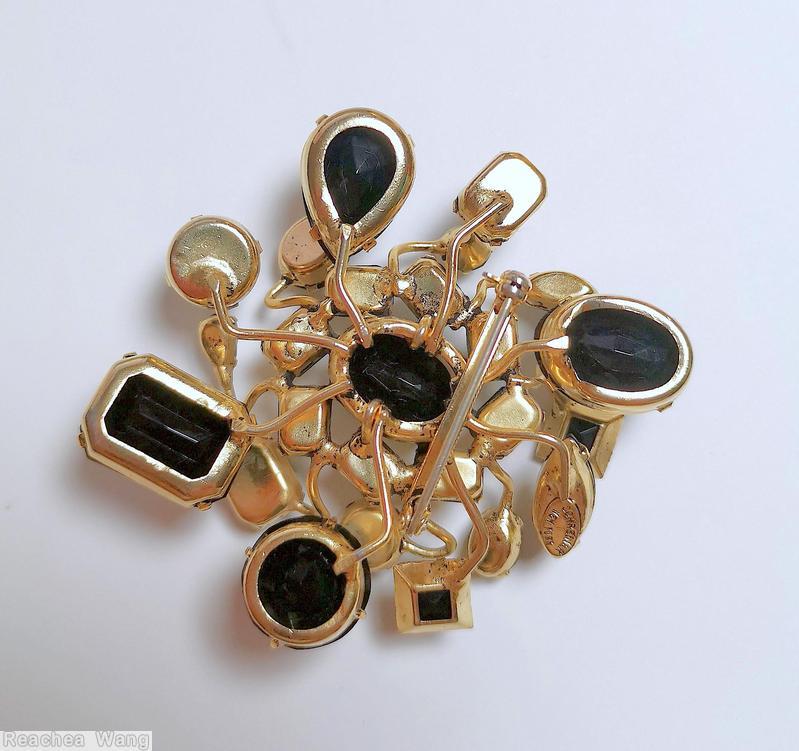 Schreiner 8 sprawling branch sprawling radial pin large oval center stone 8 surrounding emerald cut large teadrop large oval stone large round stone jet goldtone jewelry