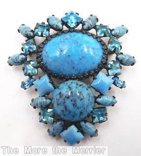 Schreiner bilateral symmetrical pin large oval stone center large round cab bottom surrounding mix of small square stone navette turquoise clear aqua opaque aqua silvertone jewelry