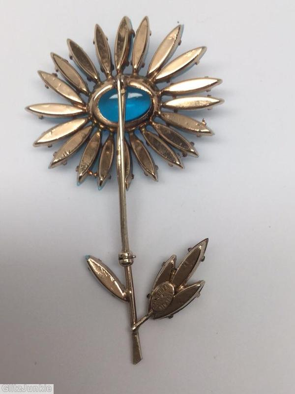 Schreiner black eye daisy pin long stem large oval center 20 petal 4 leaf baby blue navette peridot leaf navette clear aqua large oval cab jewelry