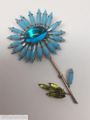 Schreiner black eye daisy pin long stem large oval center 20 petal 4 leaf baby blue navette peridot leaf navette clear aqua large oval cab jewelry