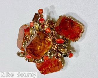 Schreiner domed center pin 1 large emerald cut swirled stone 3 surrounding large emerald cut swirled stone dark coral with brown marbled emerald cut art glass moonglow coral small navette champagne faceted navette topaz goldtone jewelry