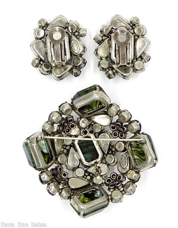 Schreiner domed square shaped pin with 5 large marbled emerald cut stone 4 surrounding teardrop 4 surrounding small chaton black marbled green emerald cut lavender green ice blue pink moonglow navy jewelry