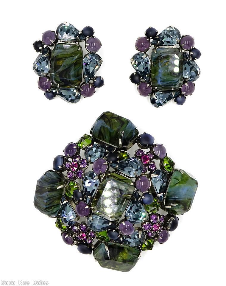 Schreiner domed square shaped pin with 5 large marbled emerald cut stone 4 surrounding teardrop 4 surrounding small chaton black marbled green emerald cut lavender green ice blue pink moonglow navy jewelry