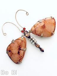 Schreiner dragonfly pin 2 large triangle marblelized stone wing 1 large navette 1 large oval stone 2 navette 6 small chaton 2 chaton eye 2 long antenna carnelian marblelized large stone large navett topaz body red small chaton eye white moonglow small chaton goldtone jewelry