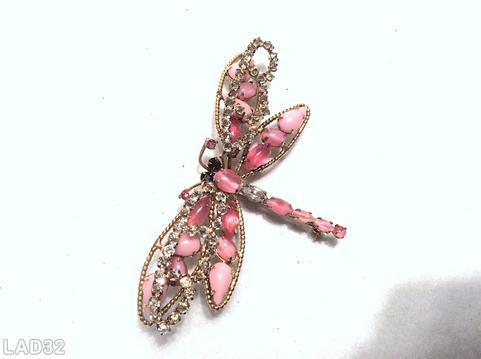Schreiner dragonfly pin 6 varied size oval cab body 2 level wings top level 2 arched with inverted stone bottom 4 wired wing large wing 2 teardrop one oval cab one navette small wing 1 teardrop 1 oval cab 1 navette opaque pink teardrop pink jelly bean crystal small inverted stone goldtone purple small chaton jet chaton eye jewelry