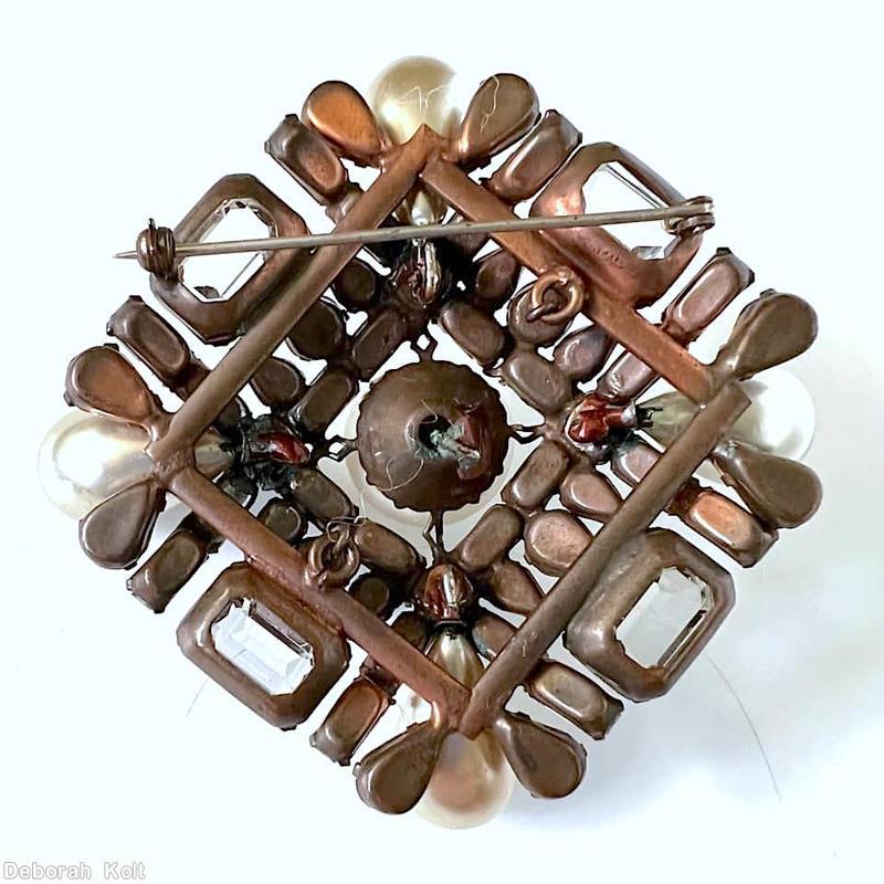 Schreiner fancy cross radial pin 2 by 2 baguette row 4 large art glass large oval cab center 4 oval cab 12 small teardrop crystal baguette ruby small teardrop large faux pearl silvertone jewelry