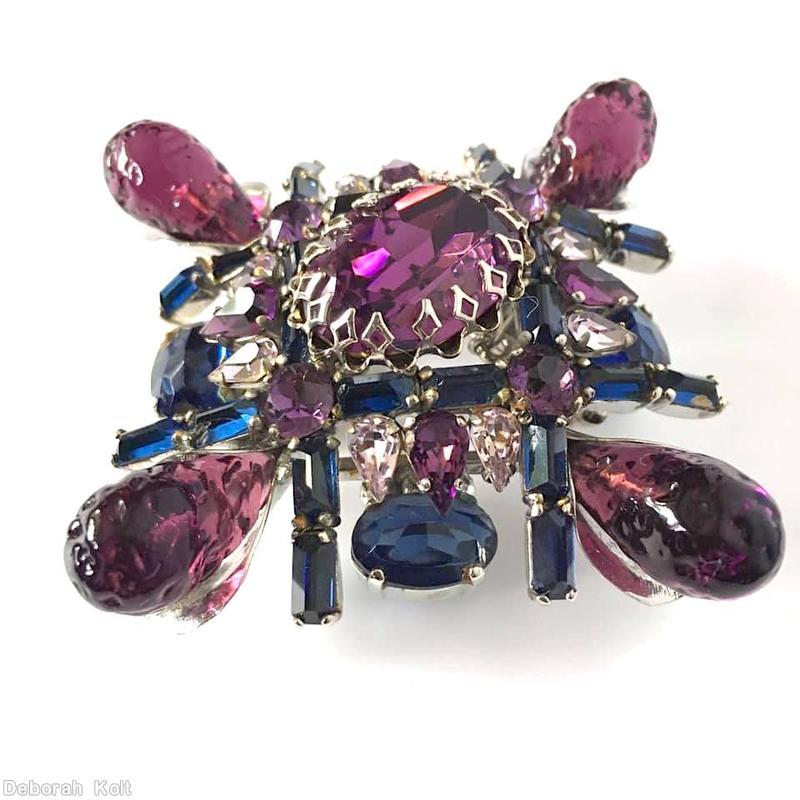 Schreiner fancy cross radial pin 2 by 2 baguette row 4 large art glass large oval cab center 4 oval cab 12 small teardrop lavender art glass purpla large oval center peach navy oval cab navy small baguette silvertone jewelry