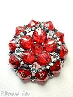 Schreiner flat top domed radial round pin 10 pointy large stone side wall pointy stone center 5 surrounding pointy stone marbled ruby pointy stone crystal inverted metalic silver seeds jewelry