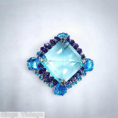 Schreiner high domed large faceted square center square pin 4 large emerald cut at corner 2 round small navette side clear aqua large faceted square open back stone purple clear aqua emerald cut silvertone jewelry