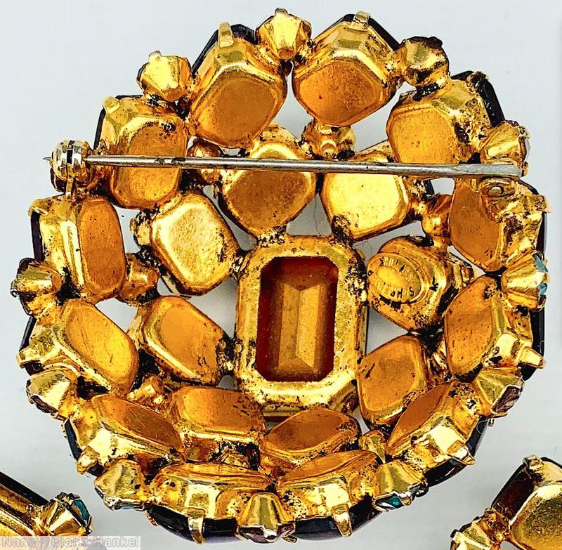 Schreiner high domed oval 20 emerald cut stone pin large emerald cut center 8 surrounding stone 12 second round stone small chaton ice blue pink fluss lapis goldtone jewelry