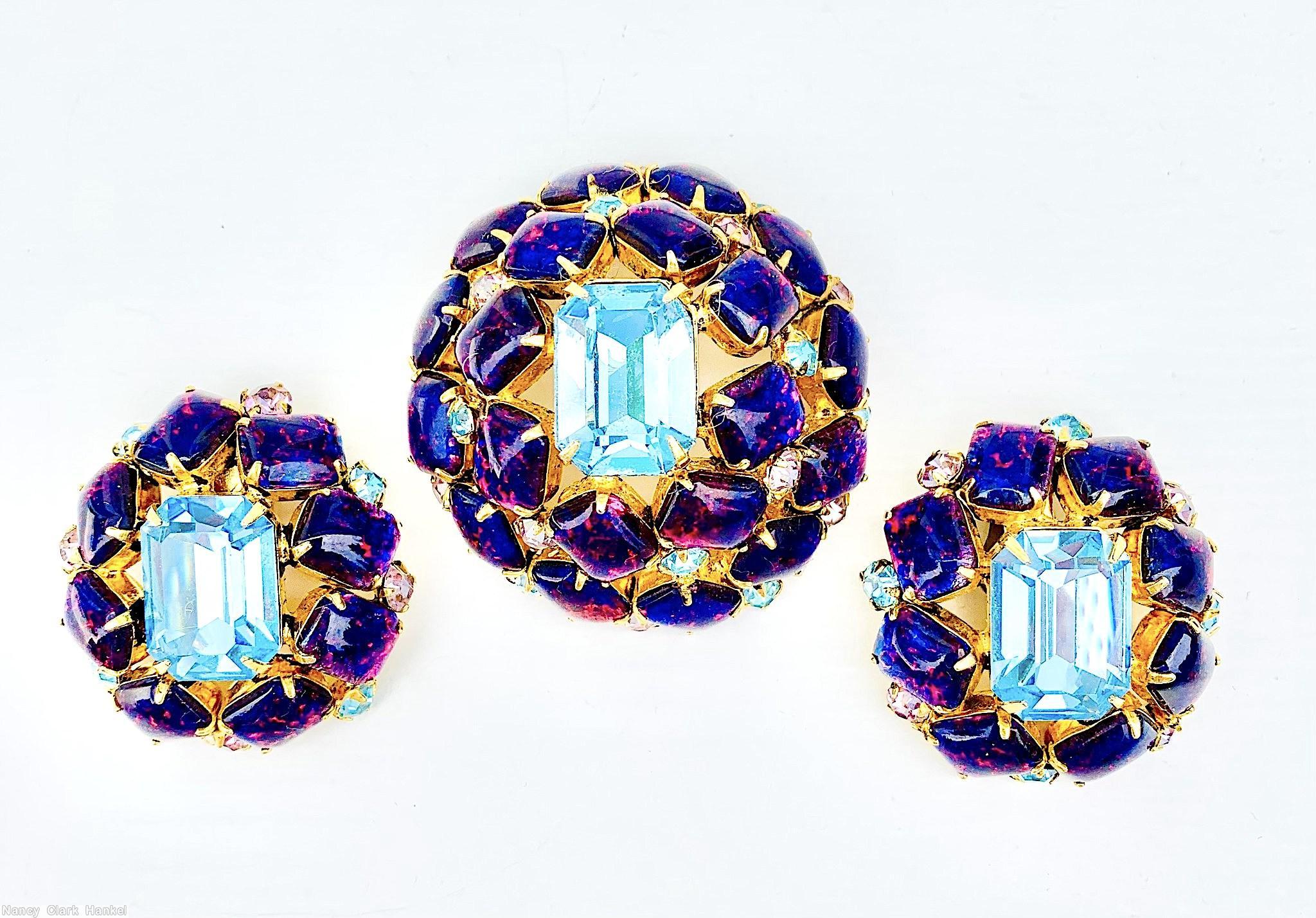 Schreiner high domed oval 20 emerald cut stone pin large emerald cut center 8 surrounding stone 12 second round stone small chaton ice blue pink fluss lapis goldtone jewelry