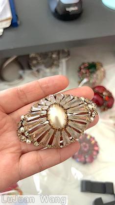 Schreiner high domed radial eye shaped ruffle pin keystone large oval center metalic large oval faux pearl center crystal keystone small faux pearl crystal inverted small stone goldtone jewelry