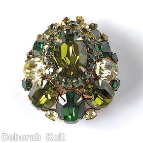 Schreiner large oval center teardrop shaped pin varied size oval cab inverted stone 2 rounds around center olivine large oval faceted center stone emerald clear champagne goldtone jewelry