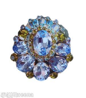 Schreiner large oval center teardrop shaped pin varied size oval cab inverted stone 2 rounds around center peridot ice blue silvertone jewelry