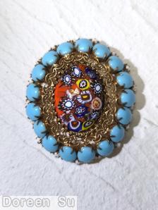 Schreiner large oval millefiori center domed oval pin filigree 17 oval cab side opaque baby blue white seeds goldtone jewelry