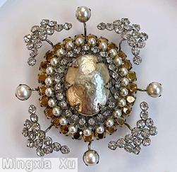Schreiner large oval shaped domed radial pin large oval faceted crystal center 23 surrounding small chaton 26 small oval stone 4 single chaton branch 4 wide arrow head branch large oval baroque pearl center surrounding small crystal chaton faux pearl small oval facete topaz jewelry