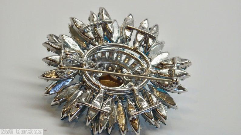 Schreiner navette ruffle pin hook eye domed oval center 2 rounds surrounding stone aqua navette ice blue faceted oval center silvertone jewelry