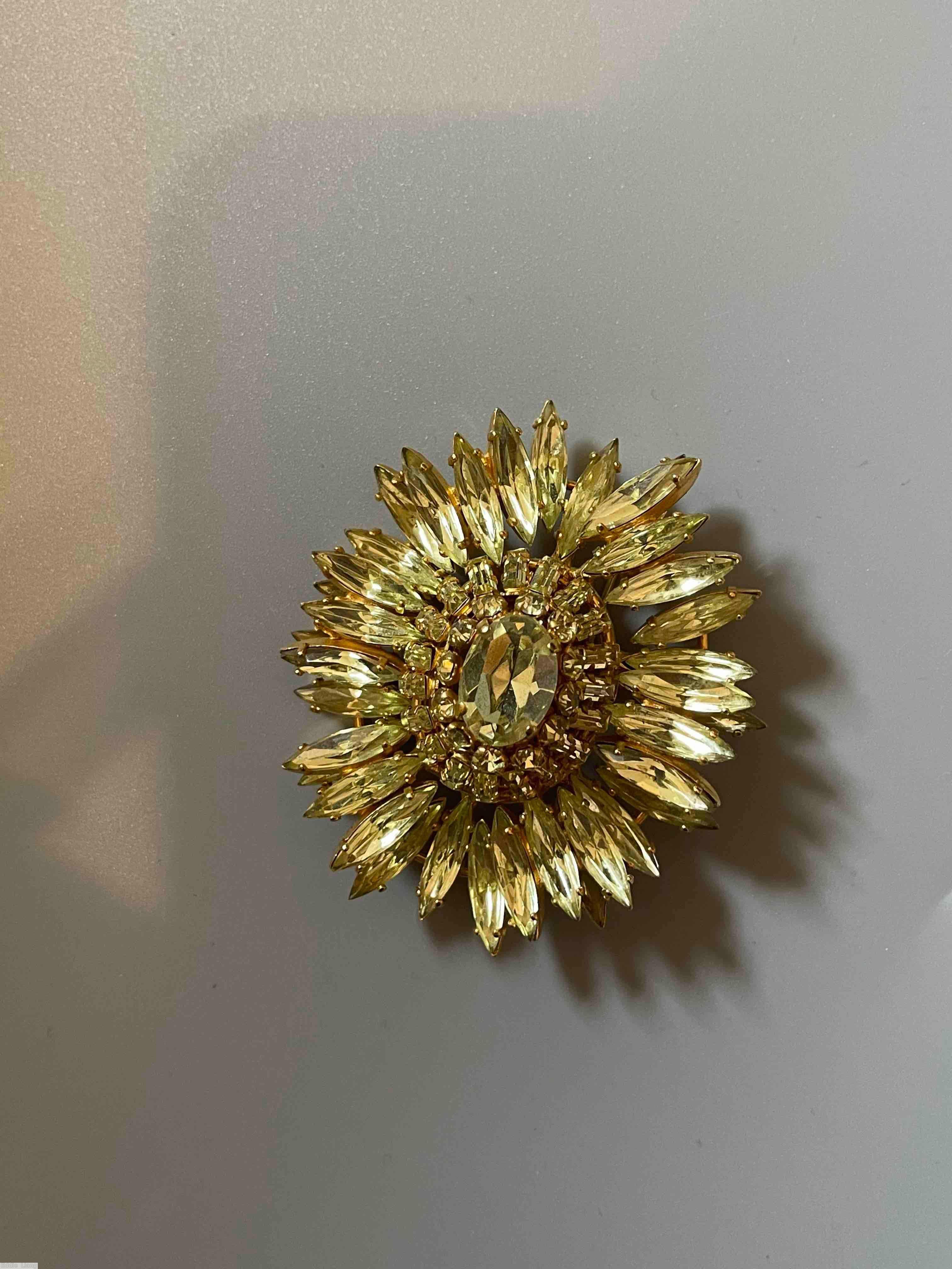 Schreiner navette ruffle pin hook eye domed oval center 2 rounds surrounding stone clear champgne goldtone jewelry