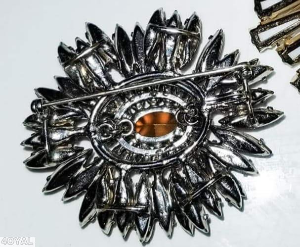 Schreiner navette ruffle pin hook eye domed oval center 2 rounds surrounding stone ruby wine jewelry