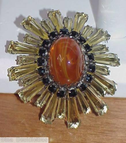 Schreiner oval high domed keystone ruffle pin large oval center varied length keystone clear champagne keystone 1 round small square stone marbled amber large oval cab jewelry