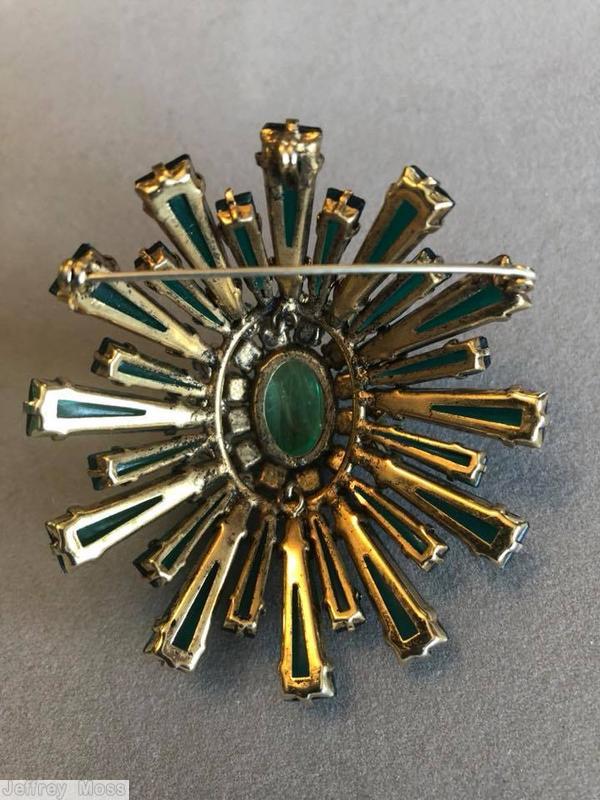 Schreiner oval high domed keystone ruffle pin large oval center varied length keystone emerald keystone 2 rounds inverted ice blue stone marbled green large oval cab center jewelry