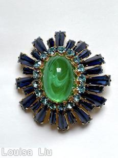 Schreiner oval high domed keystone ruffle pin large oval center varied length keystone navy keystone marbled large oval cab center ice blue small chaton goldtone jewelry