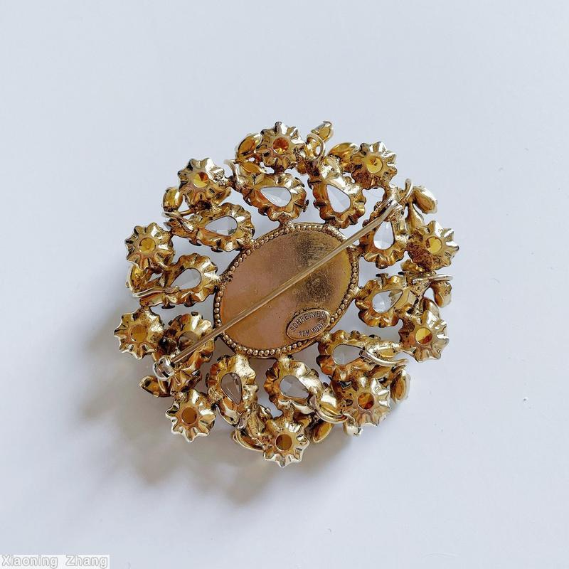 Schreiner oval radial pin large oval center cab 10 surrounding swirling teardrop 10 small branch marbled topaz large oval center cab crystal teardrop smoky blue small navette topaz inverted chaton small crystal oval stone goldtone jewelry