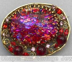Schreiner oval shadow box pin 1 large oval stone 3 round cab 4 scrollwork speckled ruby ruby pink goldtone jewelry