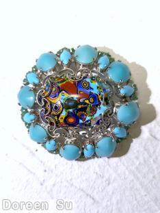 Schreiner oval shaped radial domed millefiori pin filigree 8 oval cab 8 navette large oval center millefiori moonglow aqua large oval cab opaque baby blue navette peking glass small chaton blue fillefiori silvertone jewelry