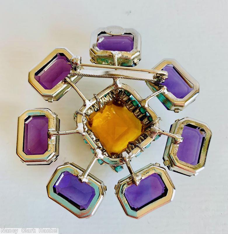 Schreiner radial 7 stem large emerald cut 1 large square faceted crystal highly domed center 18 surrounding small oval stone purple large emerald cut topaz large square faceted center turquoise small oval stone silvertone jewelry