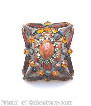 Schreiner rectangle radial domed 12 keystone pin oval cab center 6 square stone 12 surrounding chaton brown keystone carnelian square stone clear champgne inverted small surrounding stone amber matte brown inverted marbled coral oval cab center jewelry